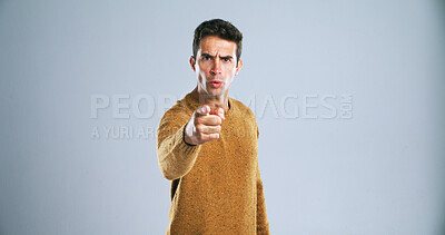 Buy stock photo Portrait, pointing to you and man with threat, blame and selection on white studio background. Angry, person and model with hand gesture, fight and mockup space with decision and accountability
