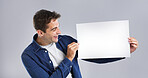 Smile, man and blank paper in studio for billboard poster, branding flyer and announcement. Happy, mockup space and show signage with person, promo information and message notice on white background