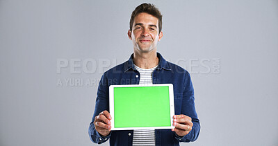Buy stock photo Tablet, man for green screen and mockup in portrait in studio, UI advertising or website ads for blog. Display space, technology or marketing for streaming subscription with promo on white background