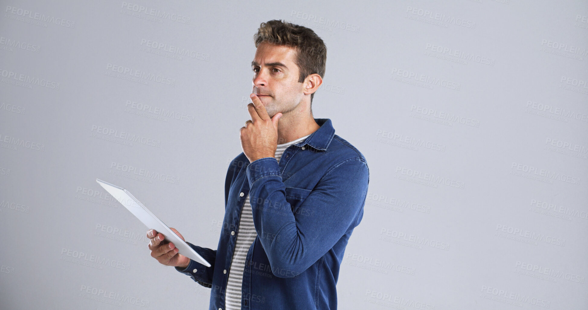 Buy stock photo Thinking, tablet and businessman in studio planning for creative project with email for client approval. Ideas, decision and graphic designer with digital tech for editing by white background space