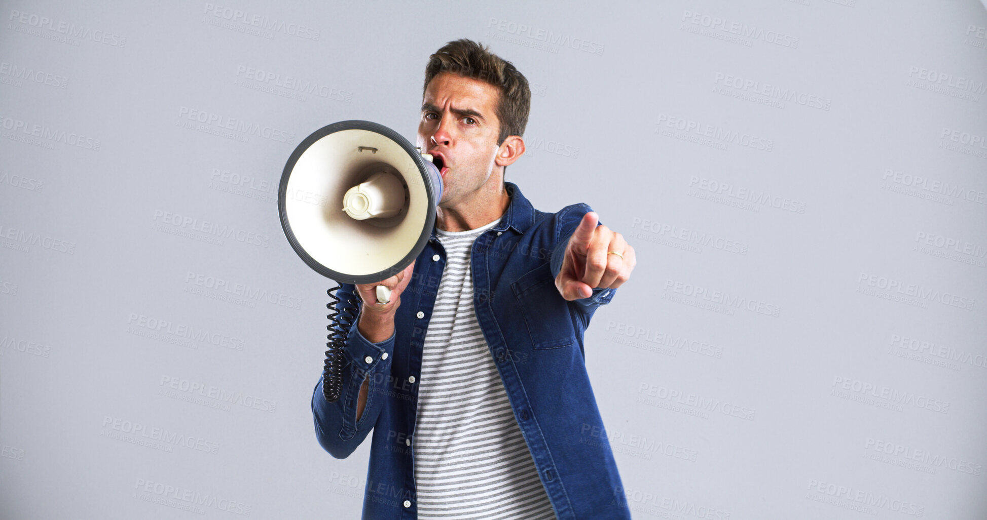 Buy stock photo Portrait, bullhorn and man in studio, screaming or angry with protest on white background. Facial expression, person or point with megaphone, frustrated or activism for human rights, noise or justice