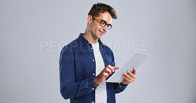 Buy stock photo Journalism, smile and tablet with editor man in studio for proofreading article of online magazine. App, glasses or post editing with freelance journalist on white background space for publishing