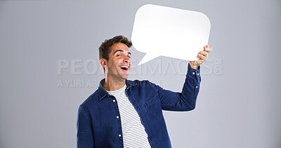 Buy stock photo Portrait, happy man and speech bubble in studio for opinion, communication forum or feedback. Social media, person and dialogue balloon for talking, quote or FAQ on white background with mockup space