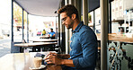 Customer, man and typing on tablet at cafe for online research, coffee break and remote work. Freelancer, person and scroll on digital app at bistro for networking, email response and check schedule