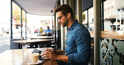 Buy stock photo Customer, man and typing on tablet at cafe for online research, coffee break and remote work. Freelancer, person and scroll on digital app at bistro for networking, email response and check schedule
