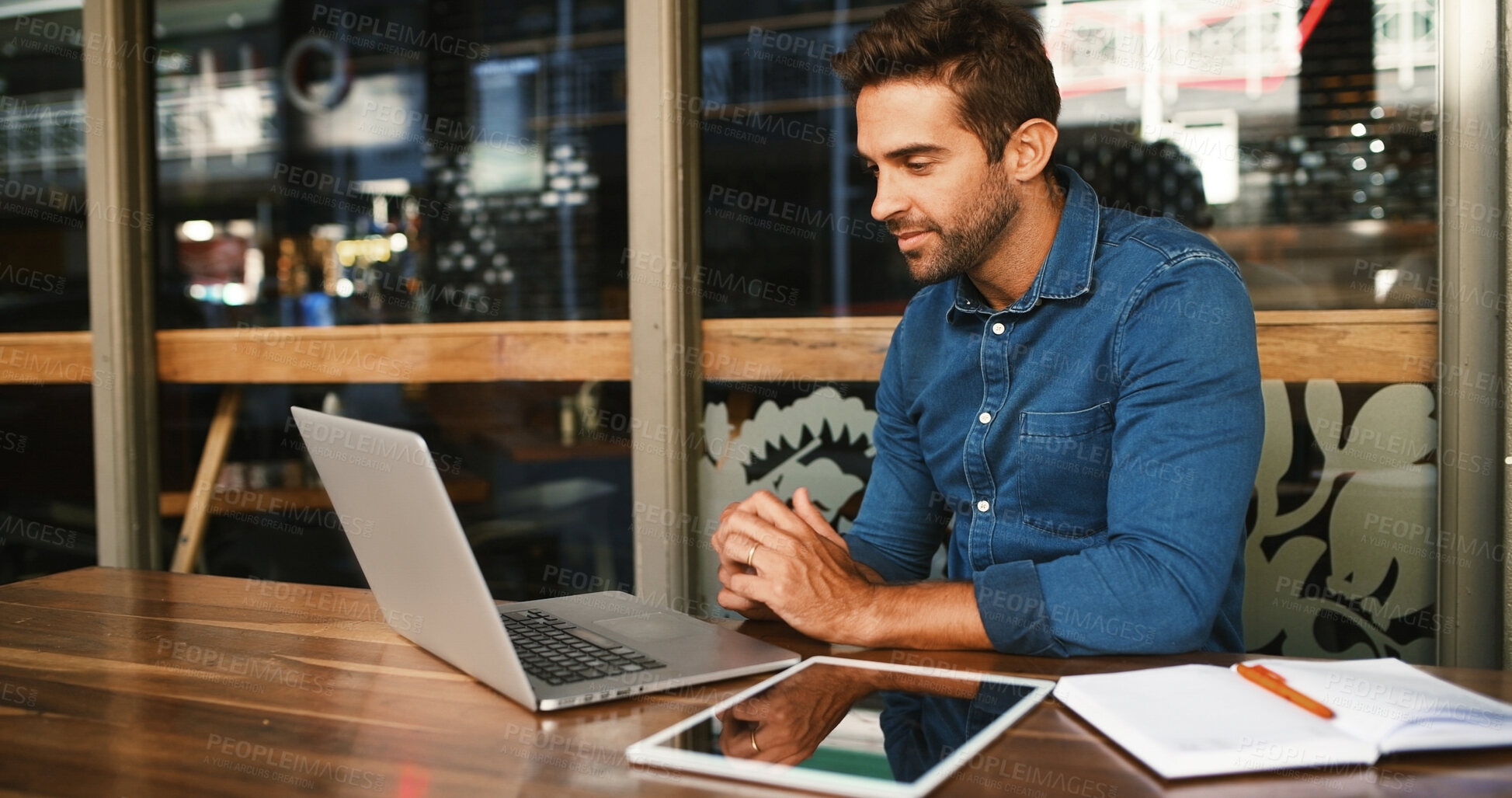 Buy stock photo Man, reading and laptop at cafe at night for research, proofreading article and information. Journalist, online and review email with story feedback, newsletter update and publishing for working late