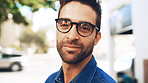 Glasses, portrait and business man in city with environmental journalist on commute. Face, confidence and professional worker outdoor, creative employee and reporter for eco friendly news in France