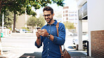 Creative man, smile and phone in city for travel, networking and taxi app for ride booking. Happy professional, person and commute with smartphone outdoor for text notification or social media scroll