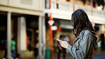 Typing, internet and woman in city, smartphone and message to contact, texting and email. Outdoor, person and mobile user with cellphone, social media and connection with communication or New Orleans