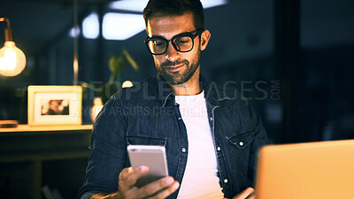 Buy stock photo Internet, night and man in office, smartphone and message to contact, social media and chatting. Person, freelancer and employee in workplace, evening and cellphone with digital app and texting