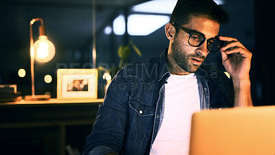 Buy stock photo Man, glasses and laptop in office at night for planning, creative ideas and proofreading article. Journalist, online and thoughts for research, blog decision and editing story of publication deadline