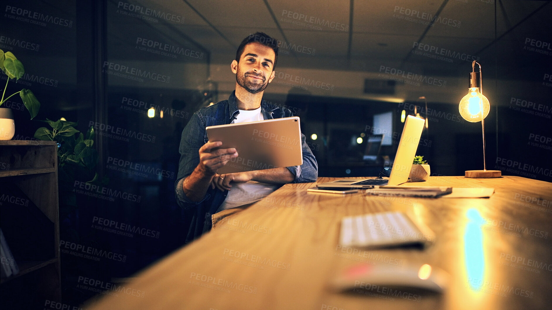 Buy stock photo Dark, business and man with tablet, portrait and app with graphic designer, internet and ideas. Person, night and employee in workplace, tech or planning for creative project or online proposal