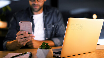 Buy stock photo Hands, night and man in office, cellphone and message to contact, social media and communication. Person, closeup and employee in workplace, evening and smartphone with digital app, texting or laptop