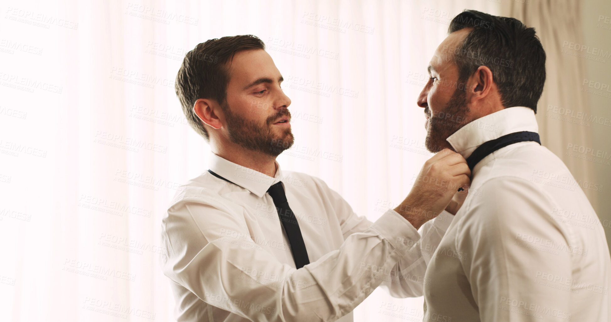 Buy stock photo Helping, groom and men with tie, wedding or preparing for ceremony, friends and advice for marriage. Space, talking and people with formal suit in hotel, conversation and assistance with clothes