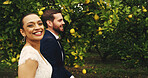 Walking, couple and smile for wedding, nature and romance for newlyweds, man and bonding with woman. Outdoor, bride and love for groom, portrait and happy for marriage, care or people with commitment
