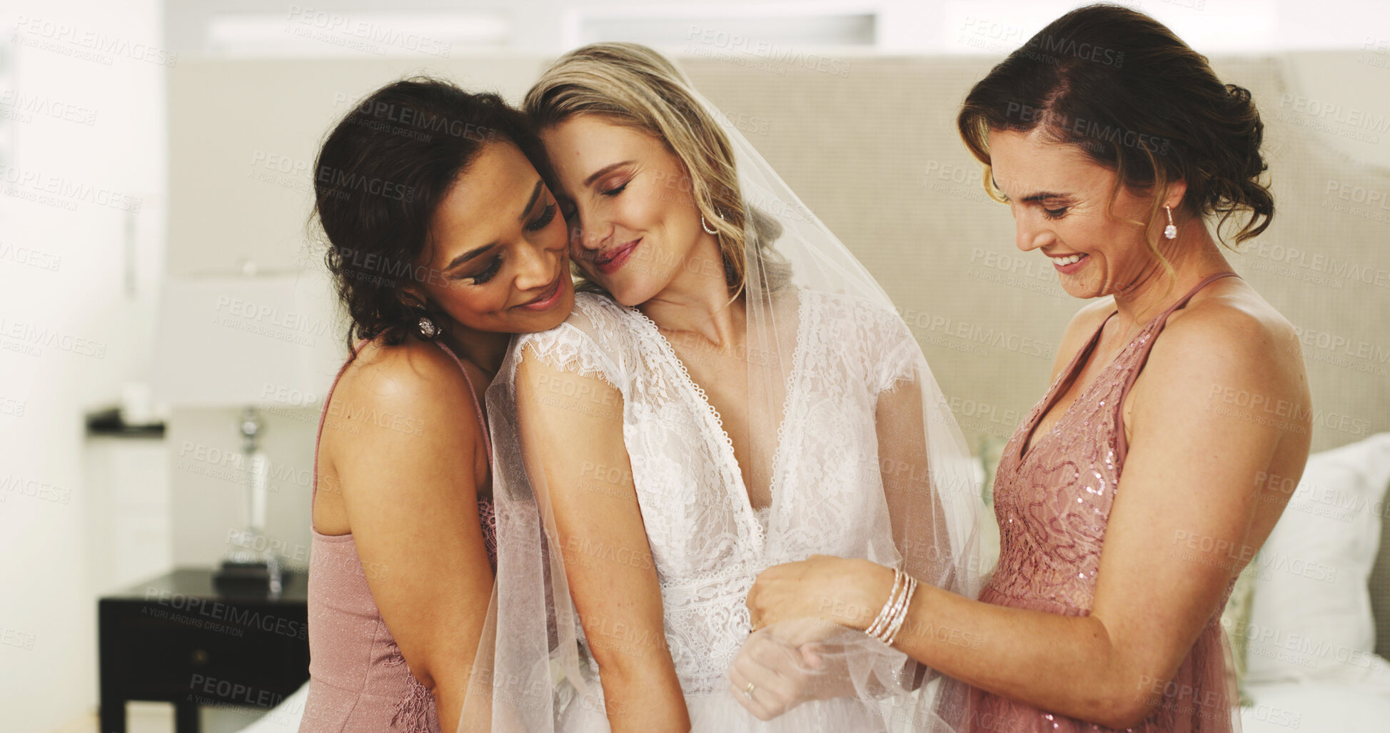 Buy stock photo Hug, wedding and friends with bride in bedroom for celebration, support and bridal party. Love, marriage ceremony and bridesmaids or women in home for getting ready, tradition and happiness for event