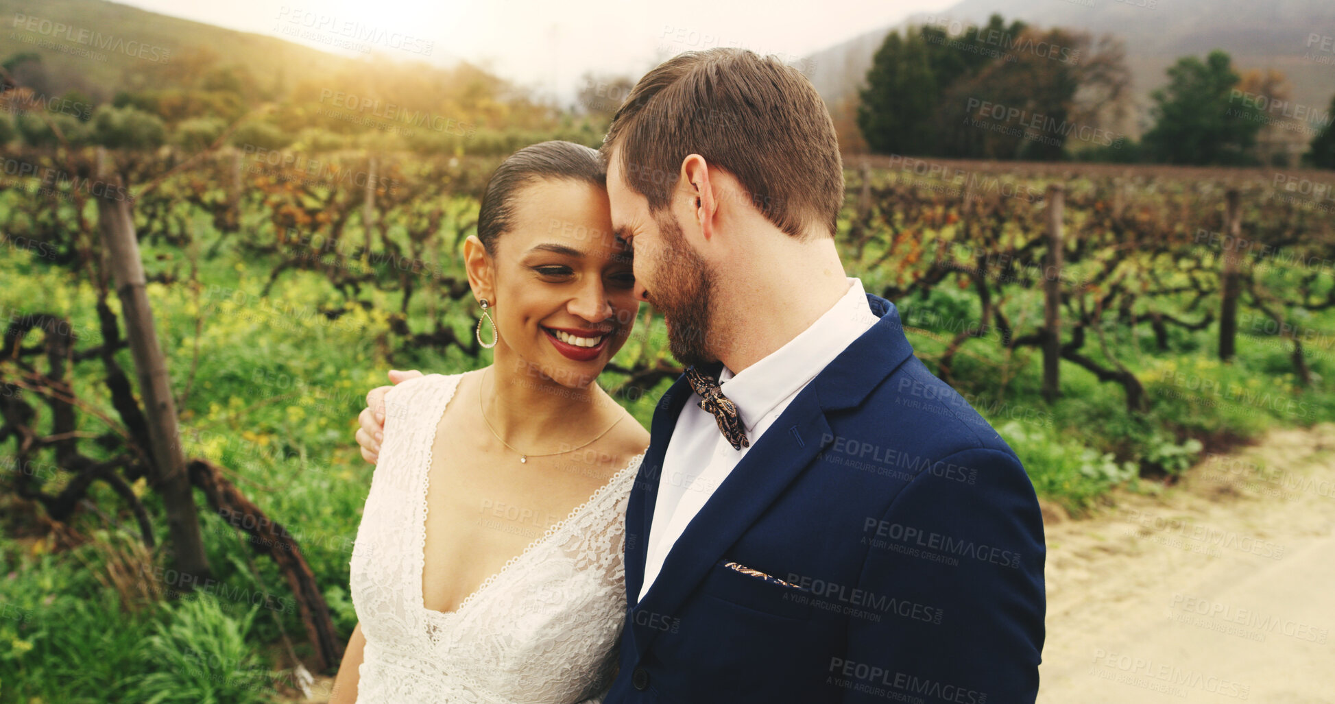 Buy stock photo Wedding, outdoor and couple with forehead touch, hug and newlyweds with smile, romance and together. Happy, man and embrace with woman for marriage, venue and affection for commitment, trust or love