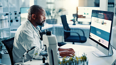 Buy stock photo Computer screen, medical and science with black man in laboratory for development or research. Article, healthcare and innovation with scientist at desk for breakthrough, clinical trial or experiment