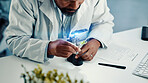 Magnifying glass, leaf and hands of black man in laboratory for gene function, biology and medical. Gmo editing, pharmacy innovation and cell regeneration with person for science, research and study