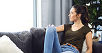 Home, thinking and woman on sofa, relax and daydreaming with contemplation in living room. Apartment, calm and happy person on couch, weekend break and ideas with decision, wonder and reflection