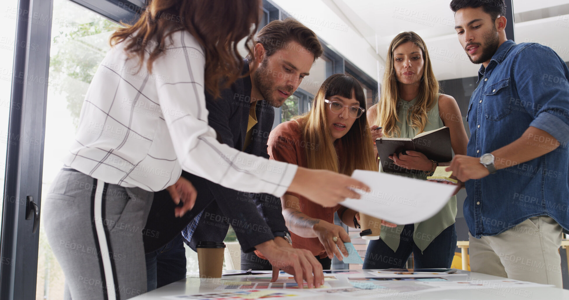 Buy stock photo Creative business people, paperwork and planning in meeting for graphic designers. Group, document and discussion in startup office for color palette, brainstorming ideas and collaboration for design