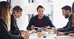 Man, group and notebook with meeting at startup with agenda, happy and strategy at company. People, journalist and editor with planning, reading and team with feedback for project at media agency