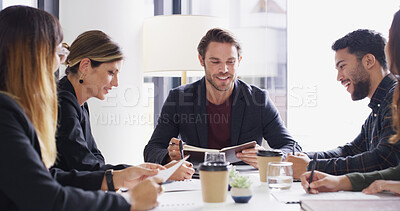 Buy stock photo Man, group and notebook with meeting at startup with agenda, happy and strategy at company. People, journalist and editor with planning, reading and team with feedback for project at media agency