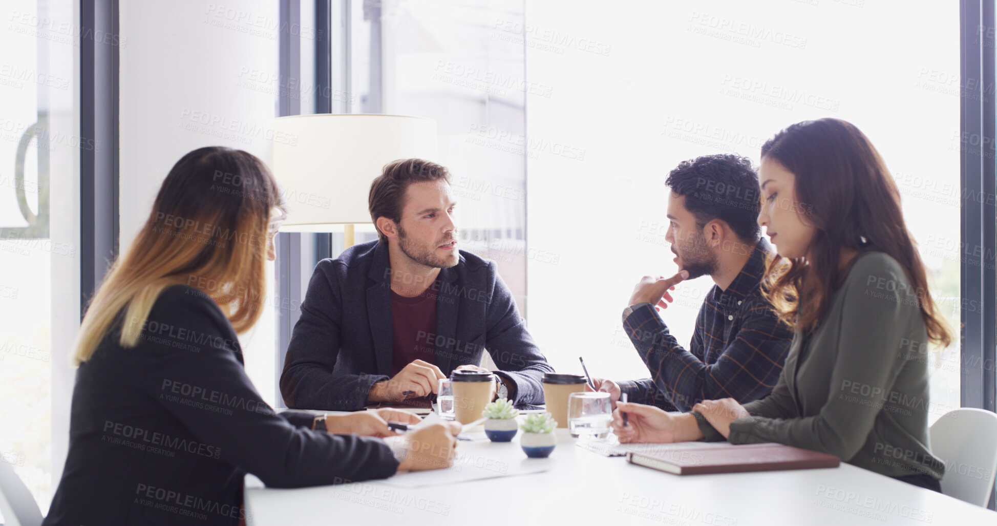 Buy stock photo Man, team and meeting with discussion in office with notes, planning or strategy at media company. People, journalist and editor with problem solving, advice or review with feedback at startup agency