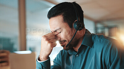 Buy stock photo Night, call center and man in office, headache and burnout with deadline, pressure and fatigue. Evening, person and consultant with migraine, tired and tension with pain, stress and customer service