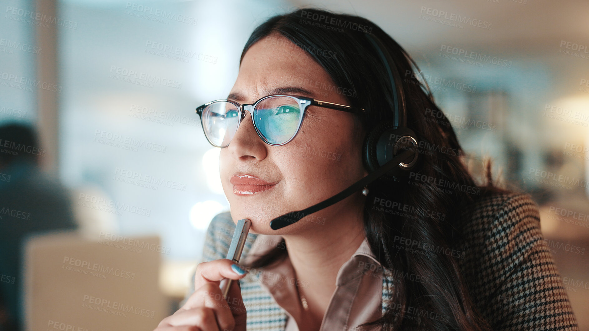 Buy stock photo Headset, reading and thinking with woman in call center for assistance, help or support at night. Communication, computer and problem solving with person at office for customer service in evening