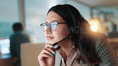 Buy stock photo Headset, reading and solution with woman in call center for assistance, help pr support at night. Communication, computer and thinking with person at office for online customer service in evening