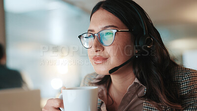 Buy stock photo Coffee, headset and reading with woman in call center for assistance, help pr support at night. Contact us, computer and solution with person drinking beverage at office for evening customer service
