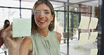 Office, businesswoman and smile on glass wall for writing, strategy and brainstorming in agency. Sticky note, female person or creative writer with moodboard for information, planning or startup goal