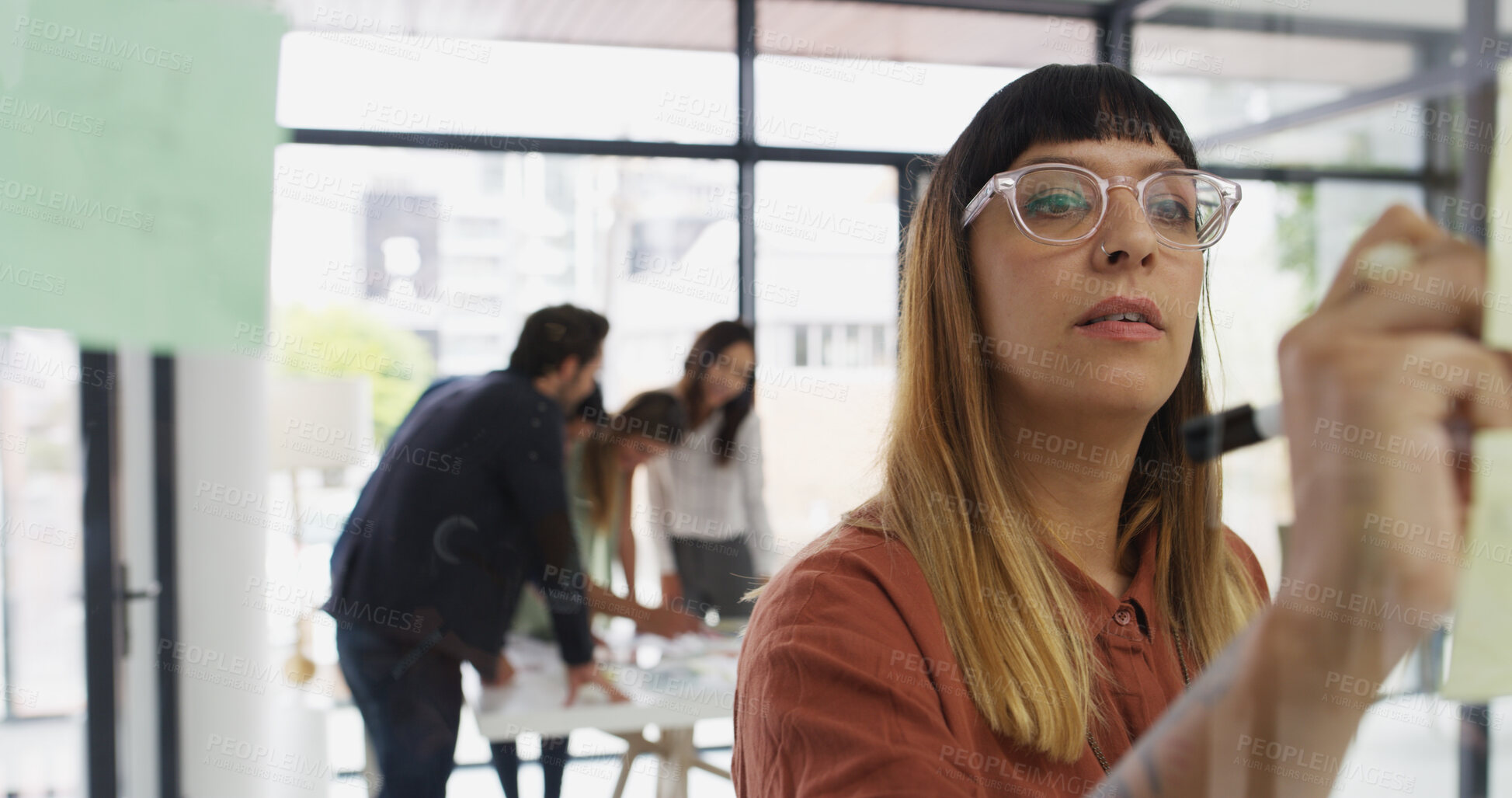 Buy stock photo Glass, businesswoman and sticky note in office for writing, strategy and brainstorming in agency. Ideas, female person or creative writer with moodboard for information, solution or startup goal