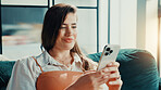 Phone, relax and text message with woman on sofa in living room of home for break or internet browsing. App, social media and weekend with person in apartment for communication, connection or search
