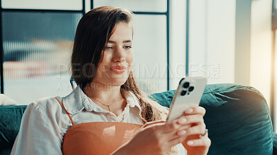 Buy stock photo Phone, relax and text message with woman on sofa in living room of home for break or internet browsing. App, social media and weekend with person in apartment for communication, connection or search