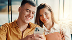 Phone, relax and smile with couple on sofa in living room of home for break or internet browsing. App, social media and text message with happy people in apartment for communication or connection