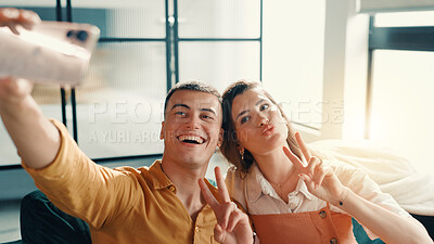 Buy stock photo Selfie, peace sign and couple on sofa in home for relax with memory, profile picture or social media post. Happy, bonding and man with woman for photography together in living room at apartment.