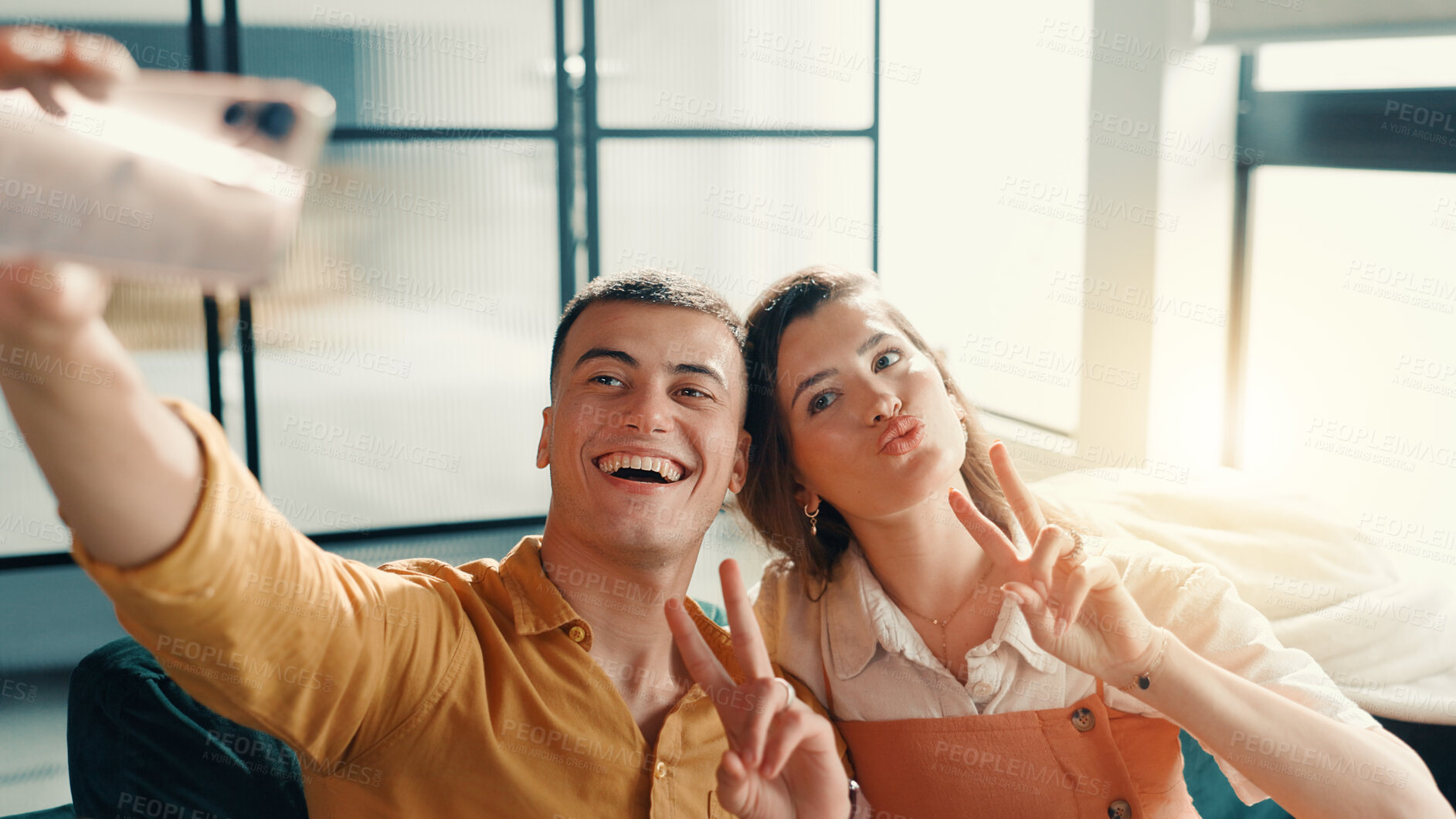 Buy stock photo Selfie, peace sign and couple on sofa in home for relax with memory, profile picture or social media post. Happy, bonding and man with woman for photography together in living room at apartment.