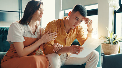 Buy stock photo Stress, couple and reading document at house financial crisis, payment notice and debt pressure. Frustrated, people and paperwork for bank repossession, loan rejection and eviction letter in lounge