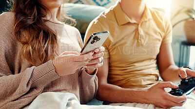 Buy stock photo Phone, controller and hands of couple in home for entertainment, gaming or social networking. Cellphone, gamer and man with woman for relaxing with mobile app or esports in living room at house.