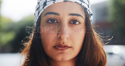 Buy stock photo Portrait, woman and outdoor with keffiyeh scarf for islamic culture, Eid Mubarak and traditional. Person, fabric and solidarity for Palestine resistance, political awareness and protest for freedom