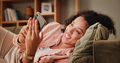 Buy stock photo Home, smile and woman on sofa, smartphone and relax with message to contact, app and social media. Apartment, mobile user and happy person on couch, cellphone and communication with chatting and text