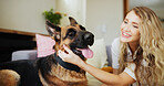 Home, woman and affection for dog, petting and love for german shepherd in living room and adoption. Happy, owner and person with rescue animal in lounge, bonding and care for canine with loyalty