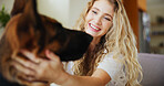 Happy, woman and love for dog, home or affection for german shepherd in living room or domestic pet. Bonding, owner and person with rescue animal in lounge, smile and care for canine with loyalty