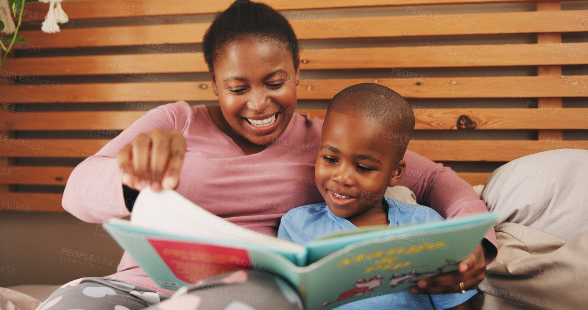 Buy stock photo Bedroom, reading book and mother with boy, smile and bonding together with hobby. African family, mama and son with learning, storytelling and child development with knowledge, literacy and home