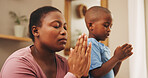 Praying, religion and black mother with child in home for worship, praise or spiritual wellness. Bonding, hope and African mom teaching boy kid with christian prayer in morning for gratitude in house