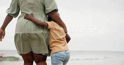 Buy stock photo Black family, back and hug with child on beach for holiday, weekend or bonding together in nature. Mom, kid or son with embrace for love, childhood or vacation on ocean coast, sea or mockup space