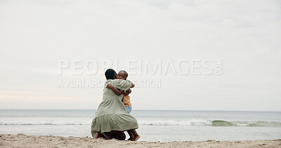 Buy stock photo Black family, back and hug with kid on beach for holiday, weekend or bonding together in nature. Mom, child or son with embrace for love, childhood or vacation on ocean coast, sea or mockup space