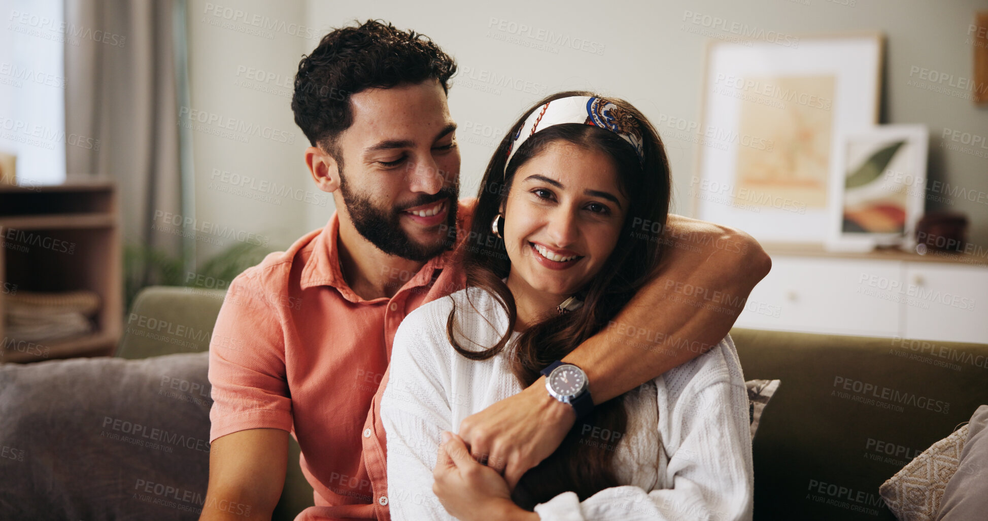 Buy stock photo Hug, happy couple and love in living room with smile, bonding and weekend date in apartment. Embrace, man and woman with portrait in house for relationship, marriage or care in home lounge for break